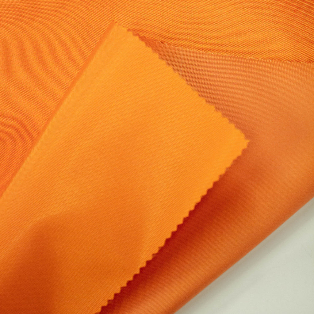 Orange Technical Polyester Fabric | THE FABRIC SALES